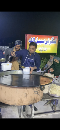 media_170_usman-abbas-serving-food-to-needy-people.png